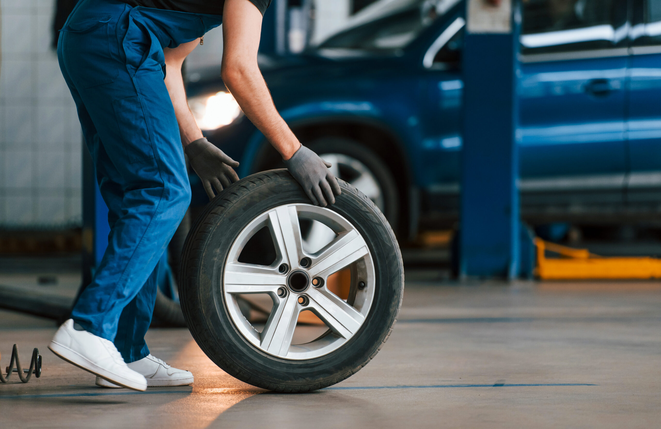 Close-up of vehicle tire and alloy rim on Canadian road